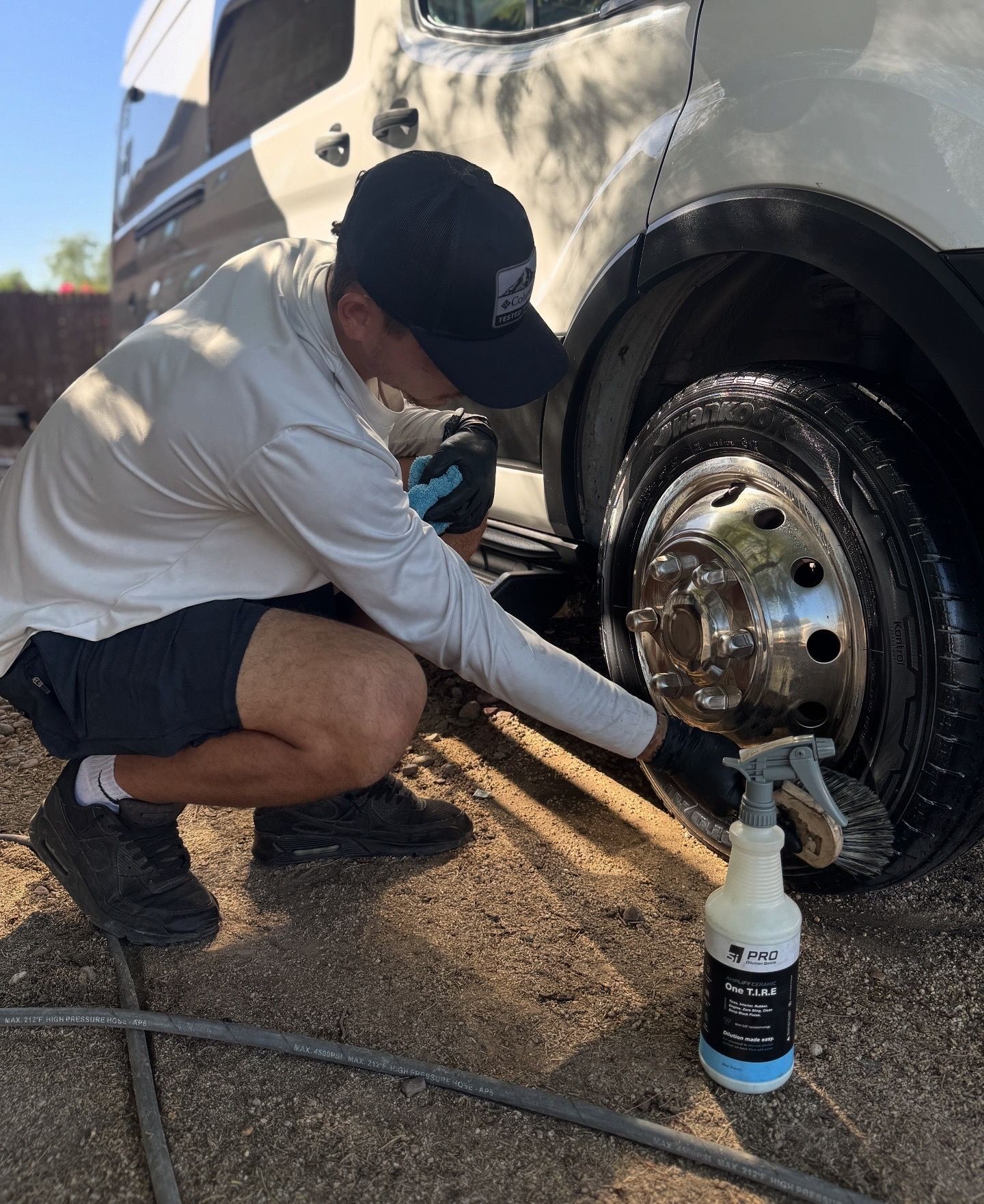 Car wash employee maintaining vehicle